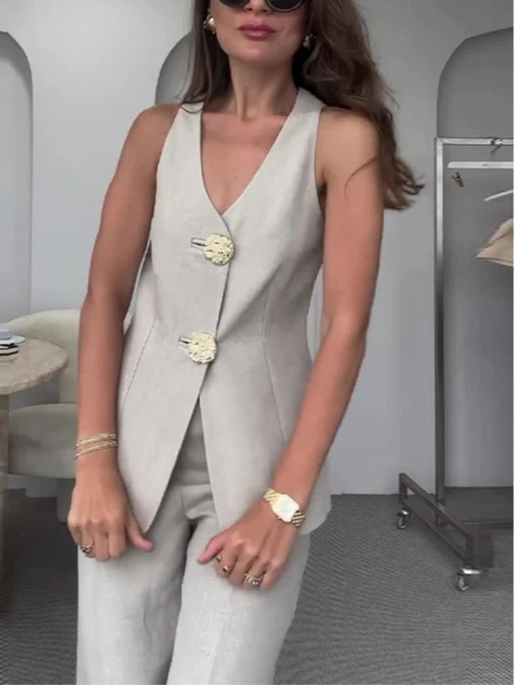 Two-piece suit with large gold button vest and pants