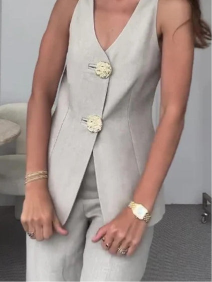 Two-piece suit with large gold button vest and pants