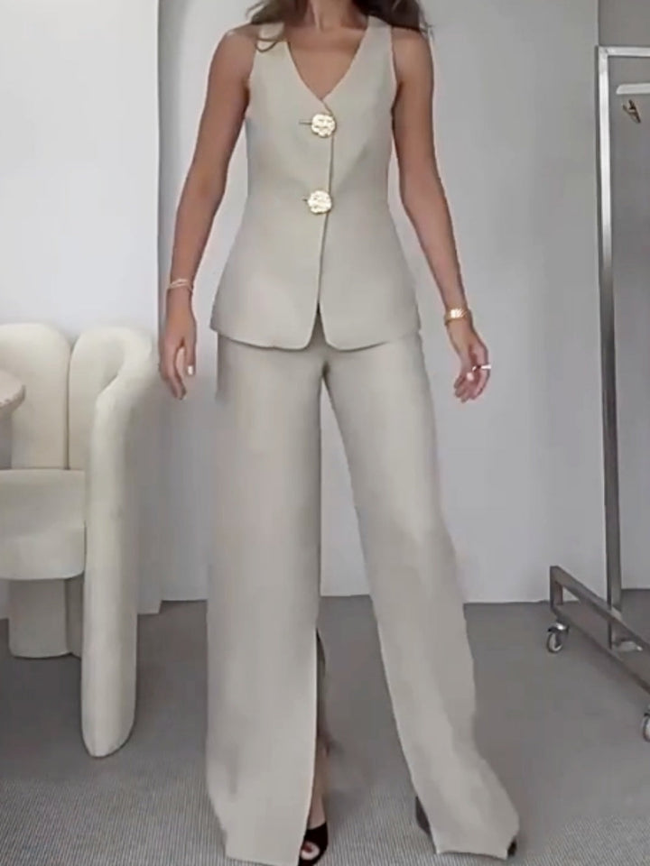 Two-piece suit with large gold button vest and pants