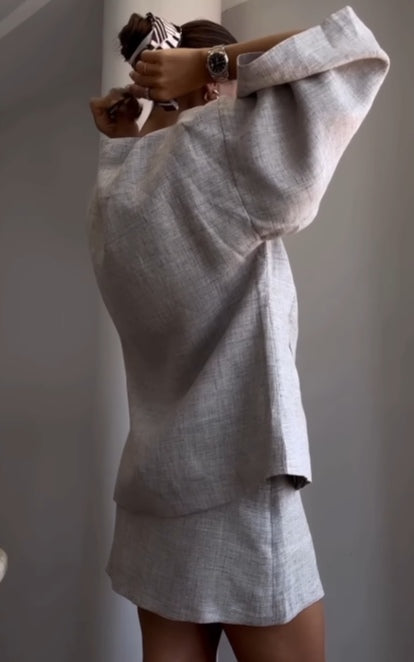 Grey long-sleeved jacket and skirt suit