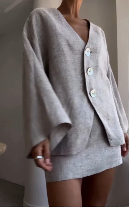 Grey long-sleeved jacket and skirt suit