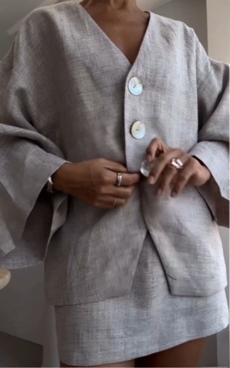 Grey long-sleeved jacket and skirt suit