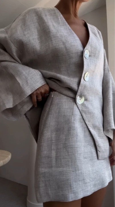 Grey long-sleeved jacket and skirt suit